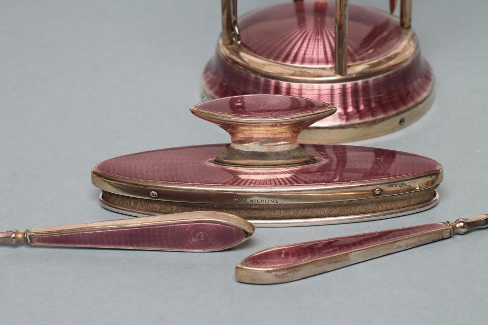 A LADY'S ART DECO LILAC GUILLOCHE ENAMEL AND SILVER EXTENSIVE BOUDOIR SET Image