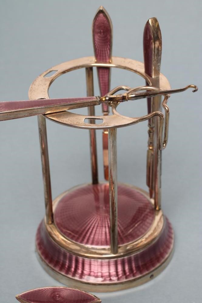 A LADY'S ART DECO LILAC GUILLOCHE ENAMEL AND SILVER EXTENSIVE BOUDOIR SET Image