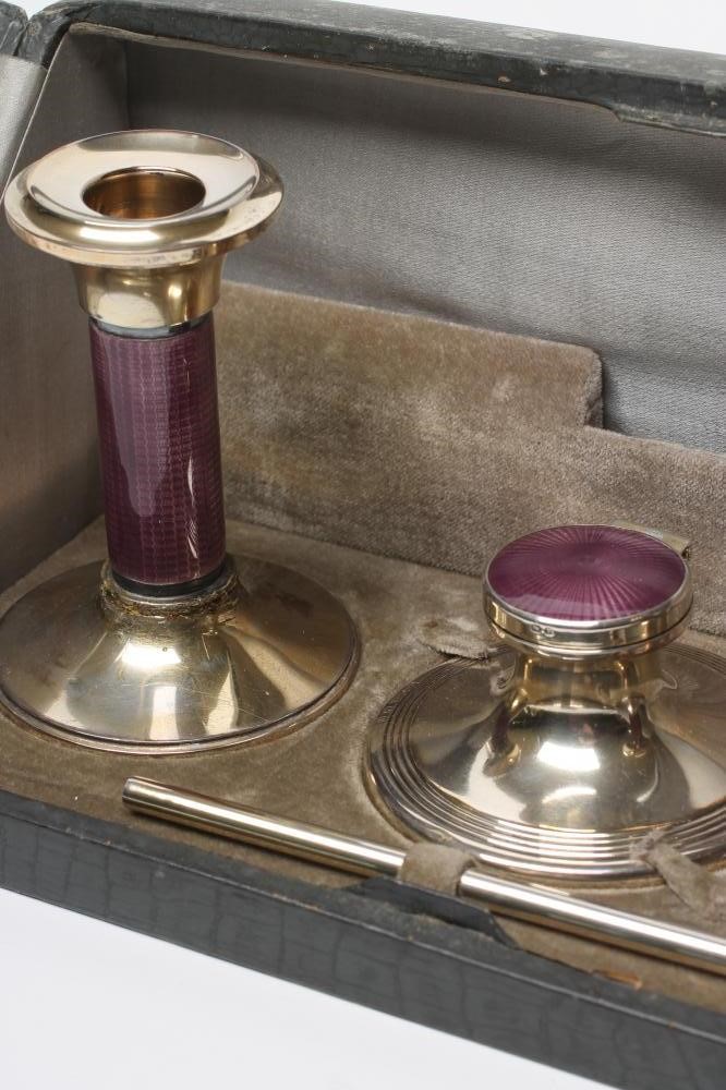 A LADY'S ART DECO LILAC GUILLOCHE ENAMEL AND SILVER EXTENSIVE BOUDOIR SET Image