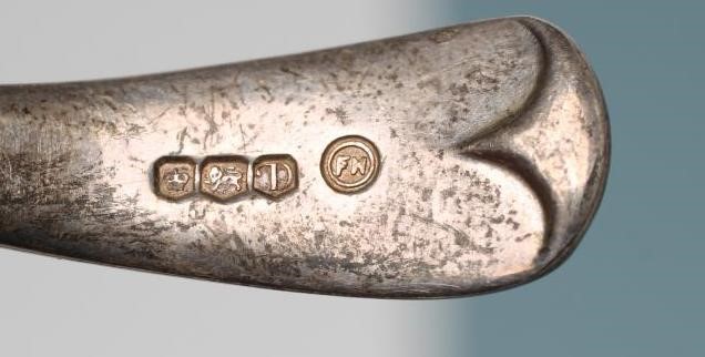 A LATE GEORGE III SILVER CADDY SPOON Image