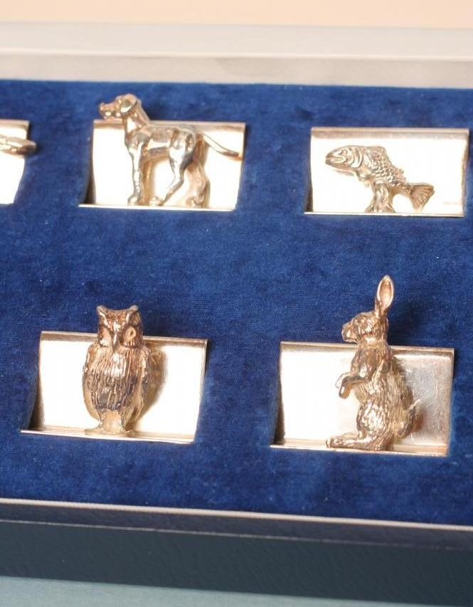 OF HUNTING INTEREST- a set of eight silver place card holders Image