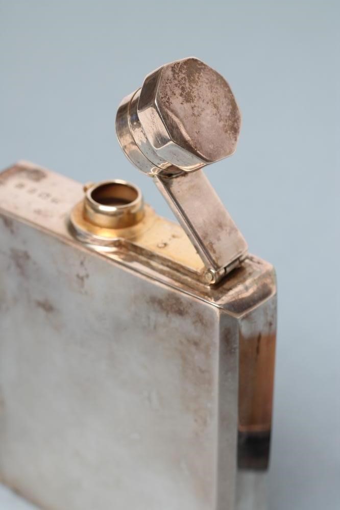 A SILVER HIP FLASK Image