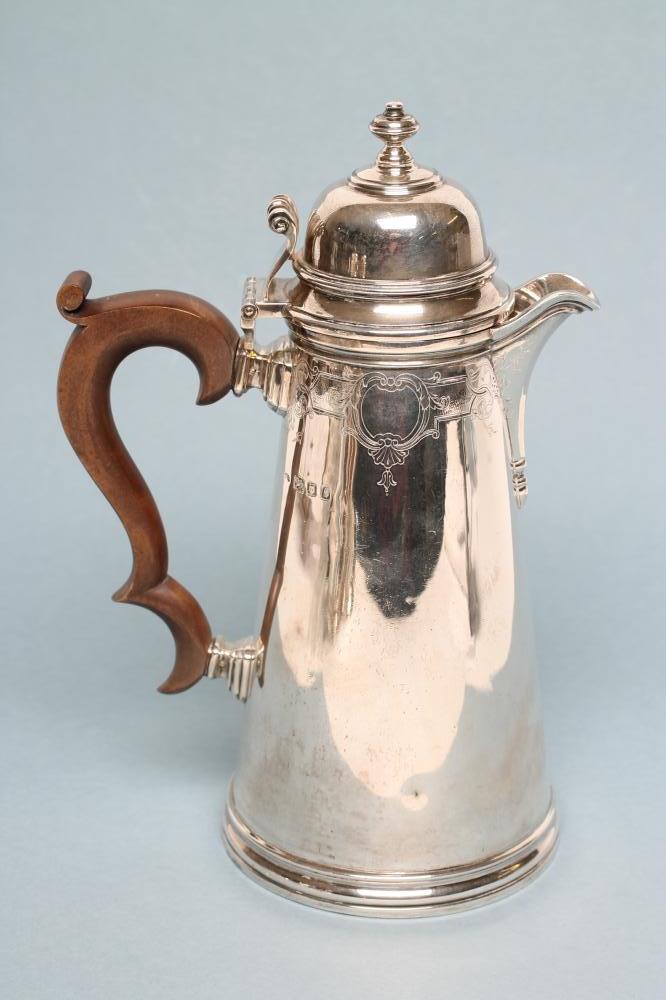 A SILVER COFFEE POT Image