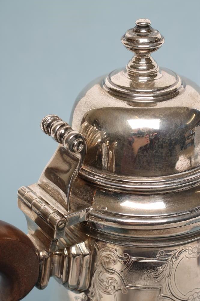 A SILVER COFFEE POT Image