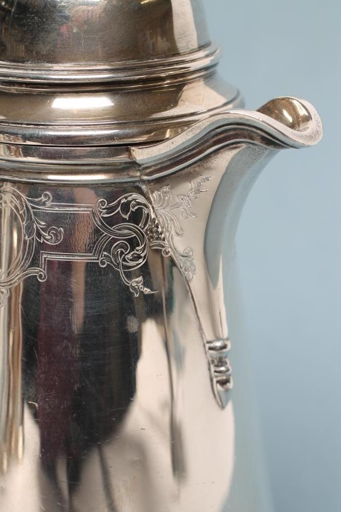 A SILVER COFFEE POT Image