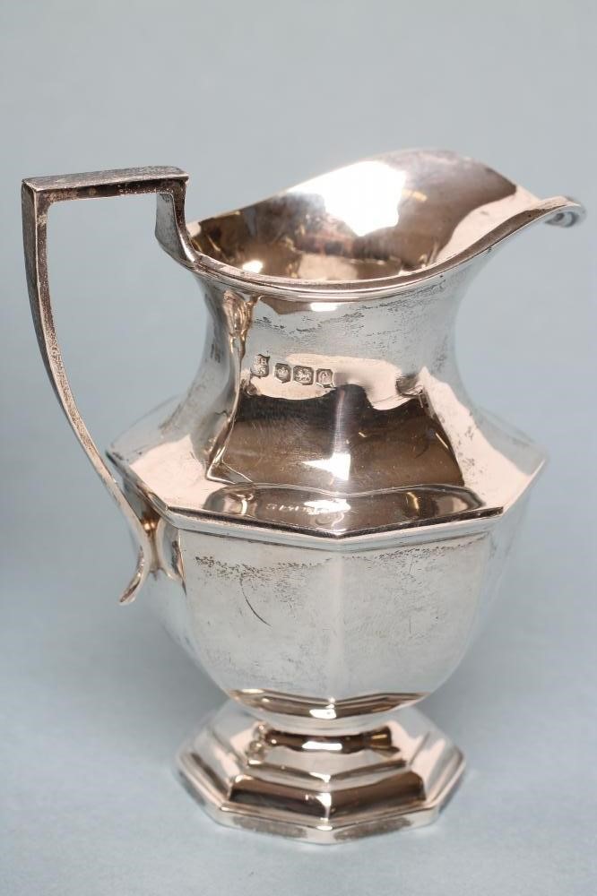 A COMPOSITE THREE PIECE SILVER COFFEE SERVICE Image