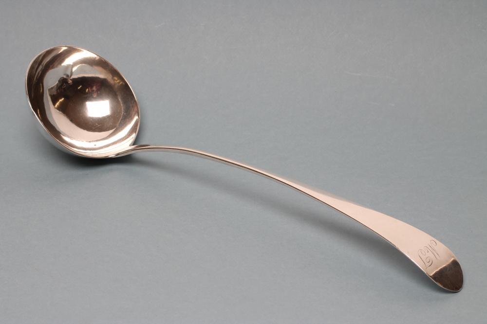 A LATE GEORGE III SILVER SOUP LADLE Image