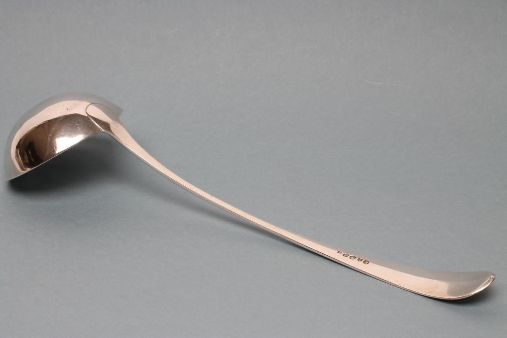 A LATE GEORGE III SILVER SOUP LADLE Image