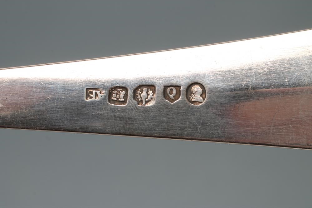 A LATE GEORGE III SILVER SOUP LADLE Image