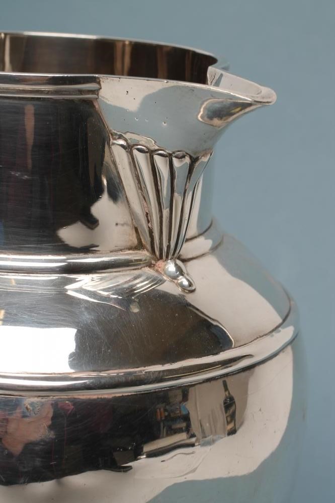 A VICTORIAN SILVER ALE JUG Image