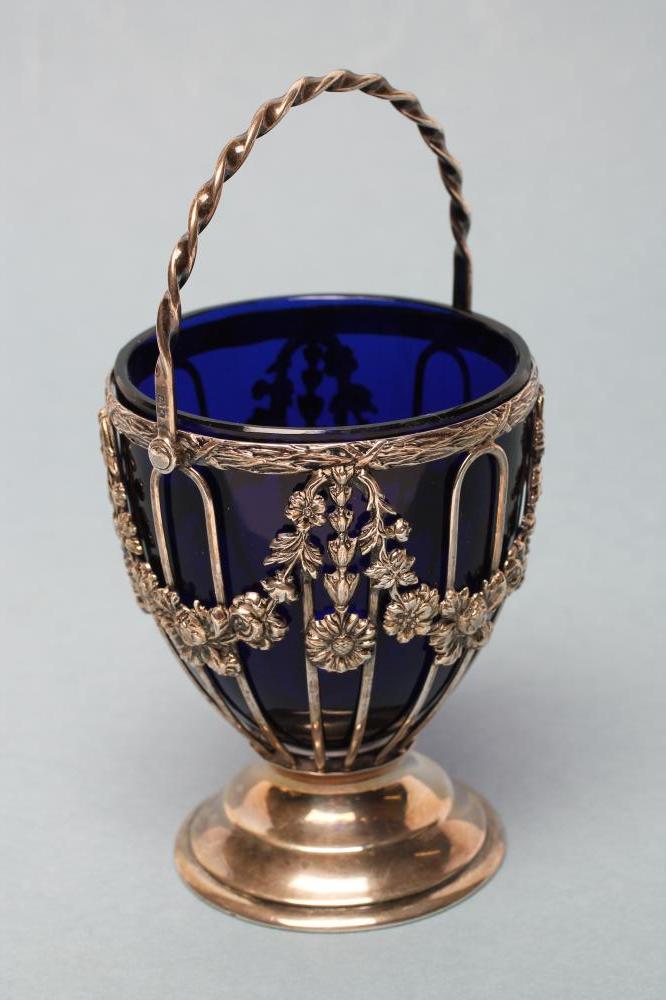 AN EDWARDIAN SILVER SUGAR BASKET Image
