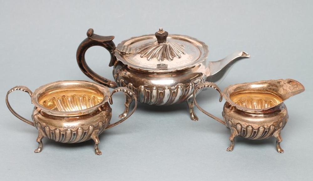 *A LATE VICTORIAN BACHELOR'S SILVER THREE PIECE TEA SERVICE Image