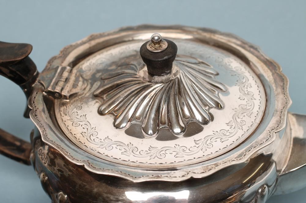 *A LATE VICTORIAN BACHELOR'S SILVER THREE PIECE TEA SERVICE Image