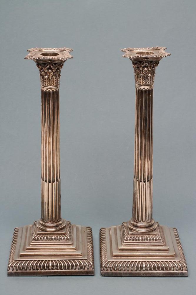 A PAIR OF LATE VICTORIAN SILVER CORINTHIAN COLUMN CANDLESTICKS Image