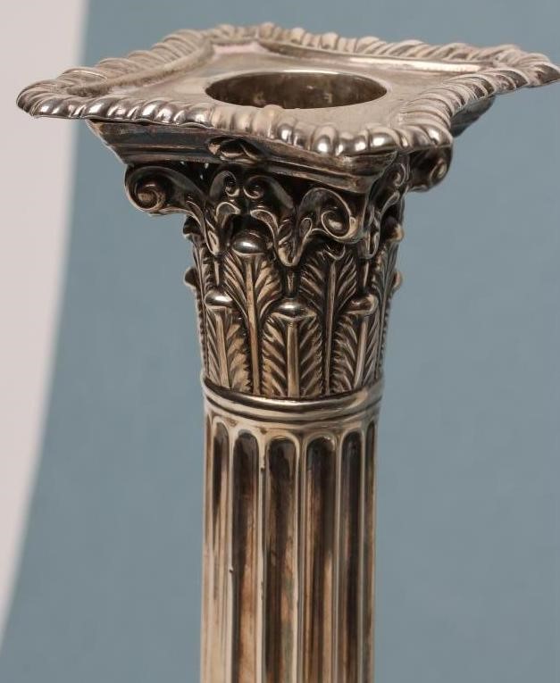 A PAIR OF LATE VICTORIAN SILVER CORINTHIAN COLUMN CANDLESTICKS Image