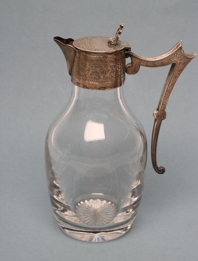 A LATE VICTORIAN SILVER MOUNTED PORT EWER Image