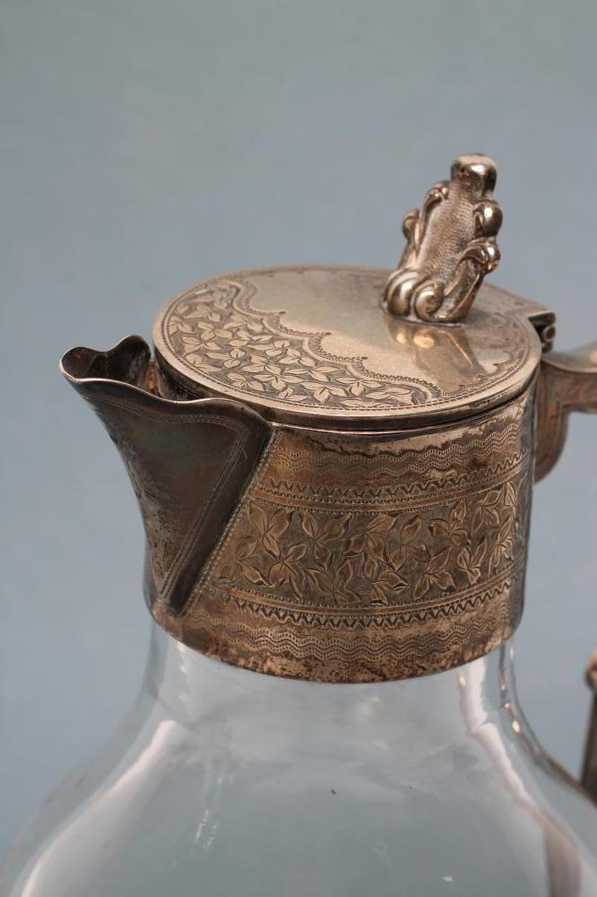 A LATE VICTORIAN SILVER MOUNTED PORT EWER Image
