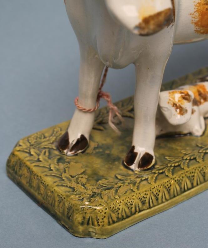 A PEARLWARE COW CREAMER AND COVER Image