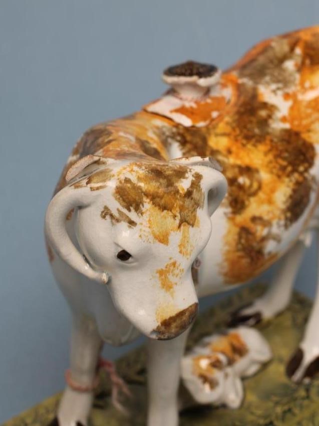 A PEARLWARE COW CREAMER AND COVER Image