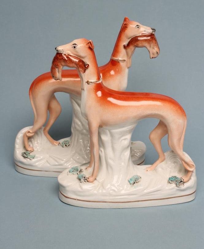 A PAIR OF VICTORIAN STAFFORDSHIRE POTTERY GREYHOUNDS Image