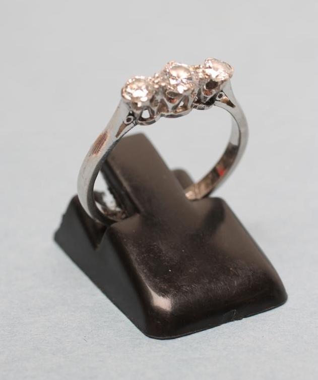 A THREE STONE DIAMOND RING Image