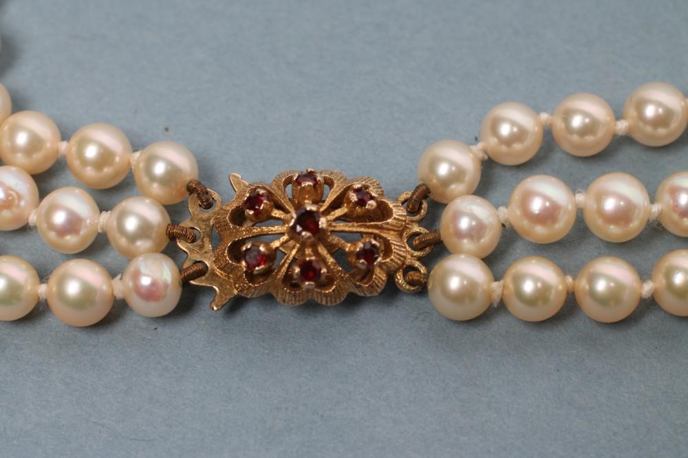 A CULTURED PEARL TRIPLE STRAND NECKLACE Image