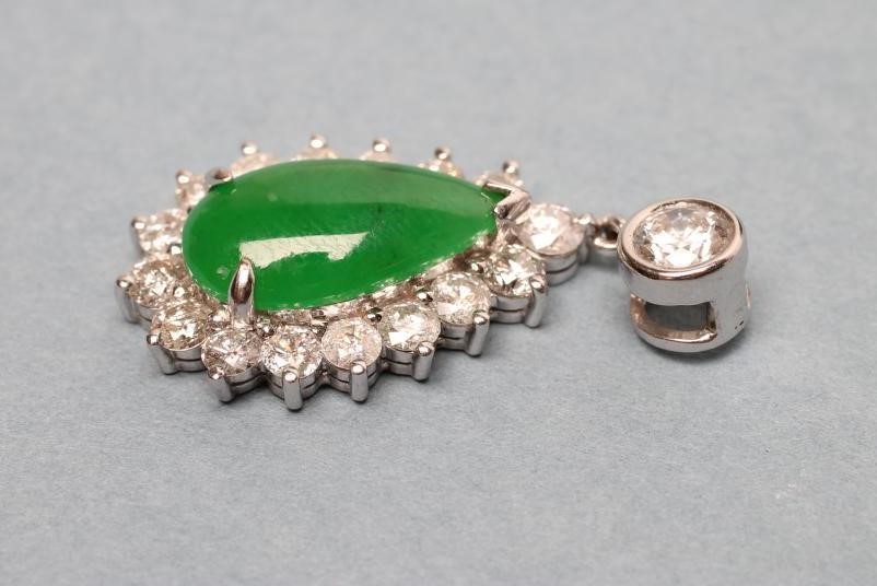 A JADE AND DIAMOND PENDANT Image