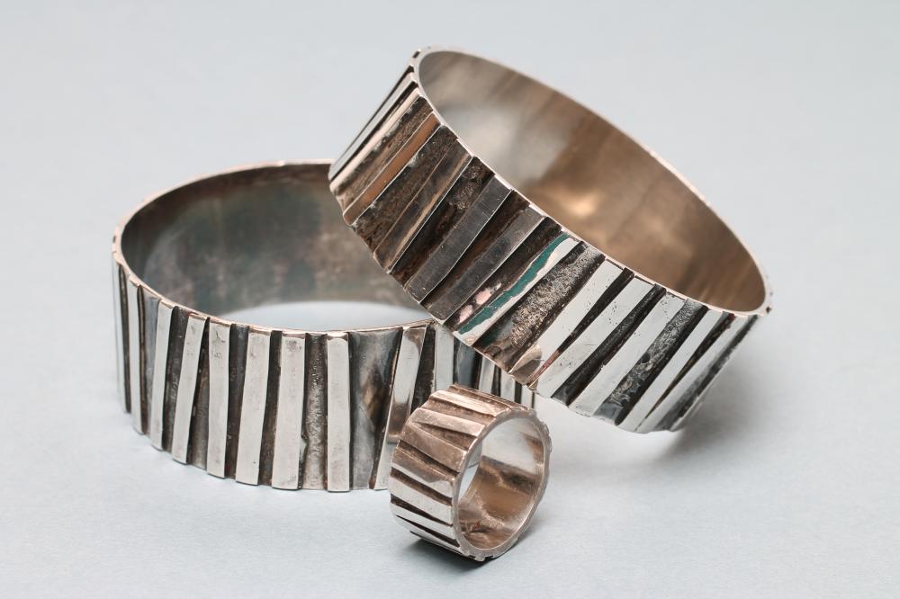 A PAIR OF MODERNIST SILVER CUFFS Image