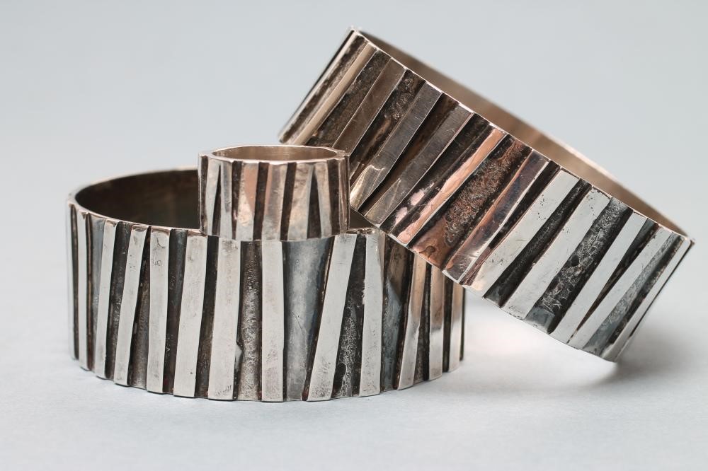 A PAIR OF MODERNIST SILVER CUFFS Image