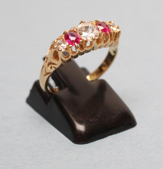 AN EDWARDIAN FIVE STONE RUBY AND DIAMOND RING Image