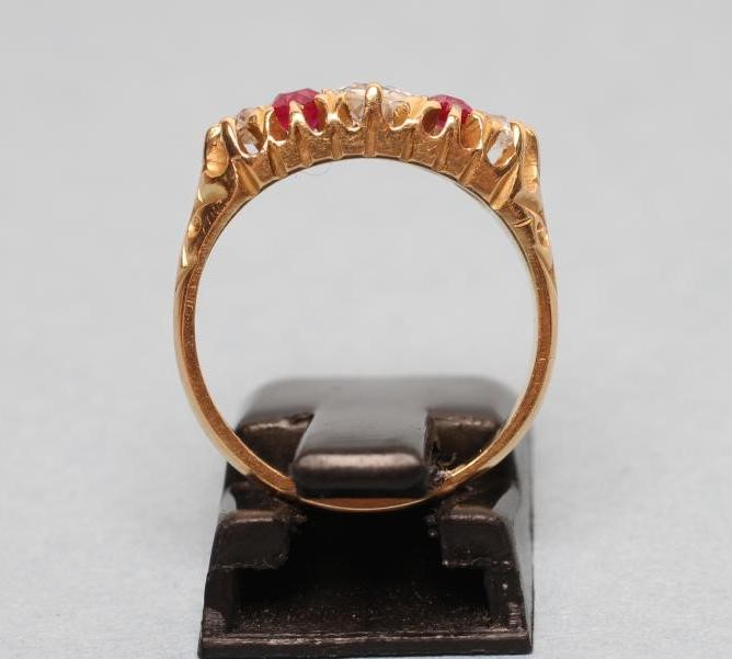 AN EDWARDIAN FIVE STONE RUBY AND DIAMOND RING Image