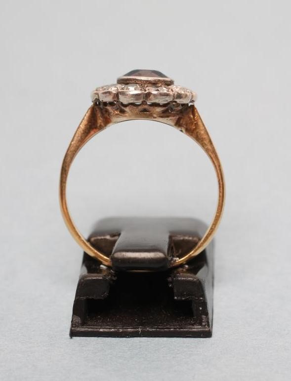 A SAPPHIRE AND DIAMOND CLUSTER RING Image