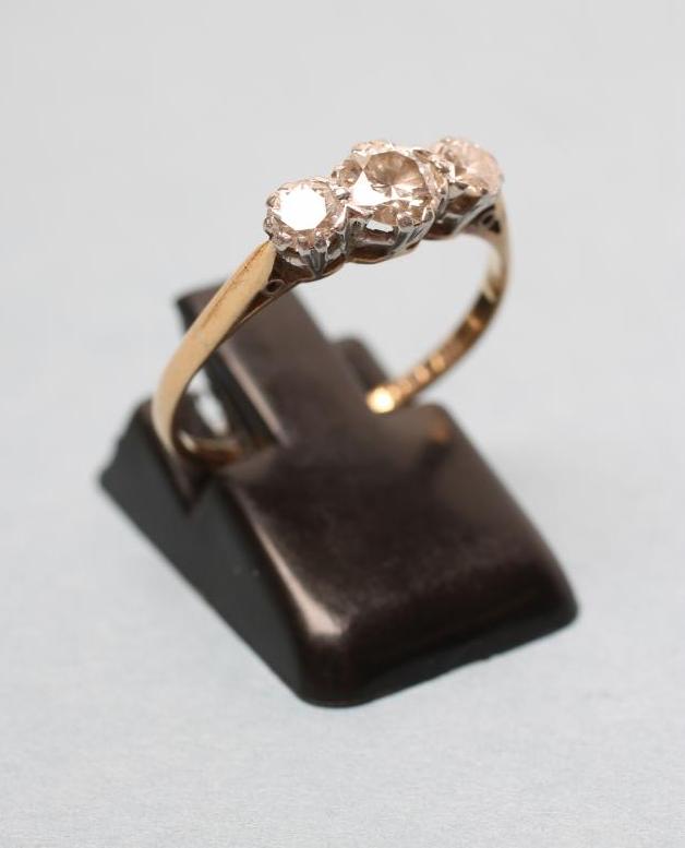 A THREE STONE DIAMOND RING Image
