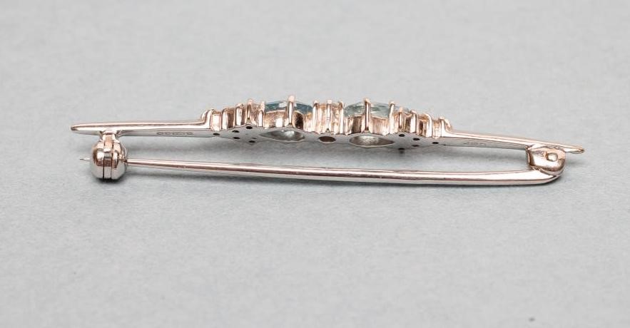 AN AQUAMARINE AND DIAMOND PROPELLOR BROOCH Image