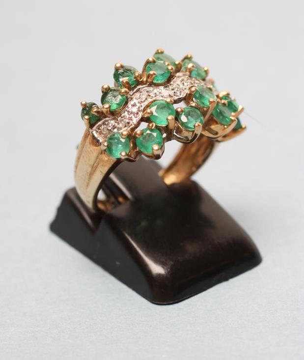 AN EMERALD AND DIAMOND DRESS RING Image