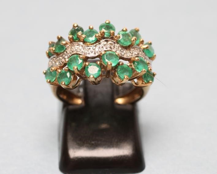 AN EMERALD AND DIAMOND DRESS RING Image