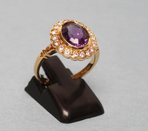 AN AMETHYST AND DIAMOND CLUSTER RING Image