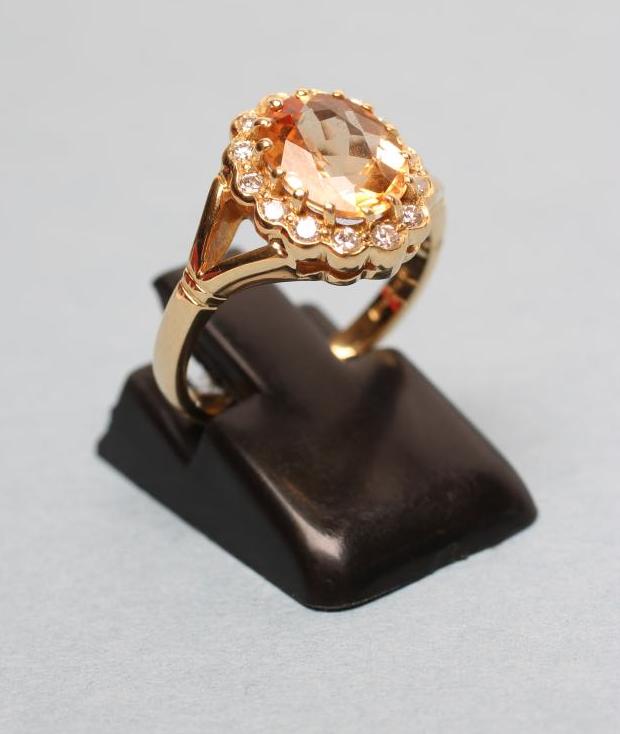 A CITRINE AND DIAMOND CLUSTER RING Image