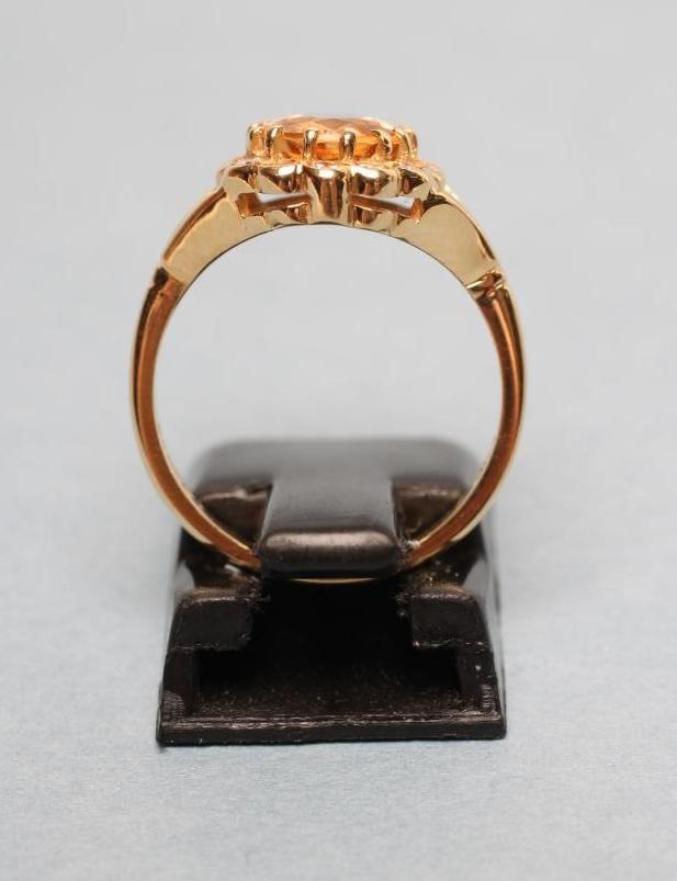 A CITRINE AND DIAMOND CLUSTER RING Image