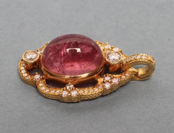 A PINK TOURMALINE AND DIAMOND PENDANT Image