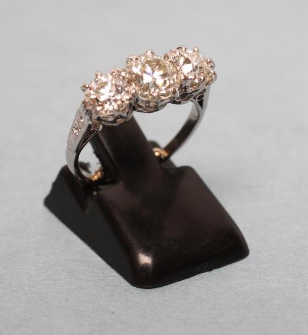 A THREE STONE DIAMOND RING Image