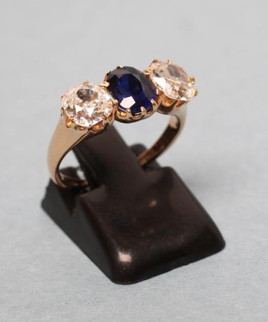 A LATE VICTORIAN SAPPHIRE AND DIAMOND THREE STONE RING Image
