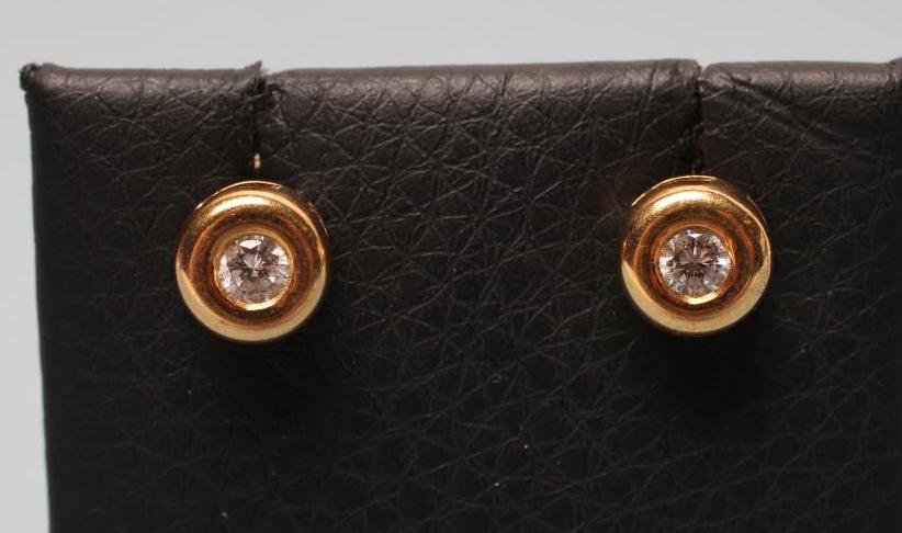 A PAIR OF SOLITAIRE DIAMOND EAR STUDS Image