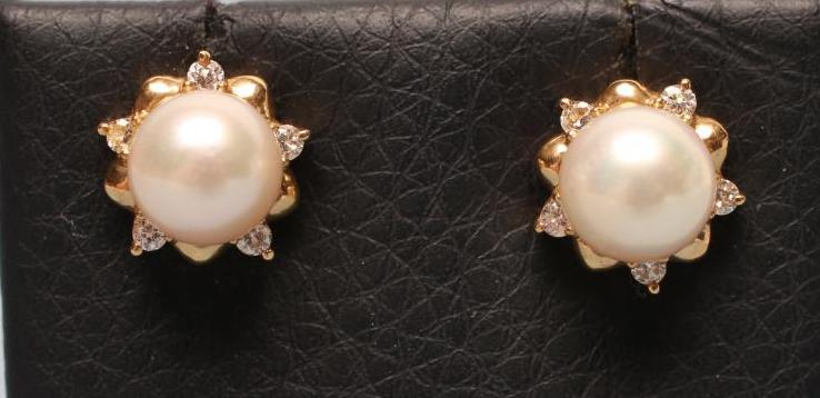A PAIR OF CULTURED PEARL AND DIAMOND EAR STUDS with plain 18ct gold posts Image