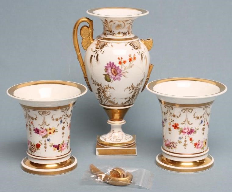 A ROCKINGHAM PORCELAIN MATCHED THREE PIECE GARNITURE Image