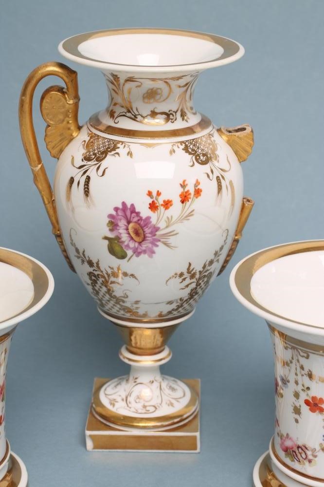 A ROCKINGHAM PORCELAIN MATCHED THREE PIECE GARNITURE Image