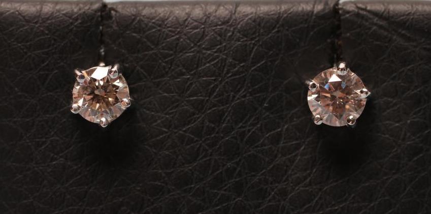 A PAIR OF DIAMOND EAR STUDS Image