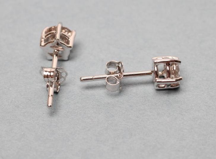 A PAIR OF DIAMOND EAR STUDS Image