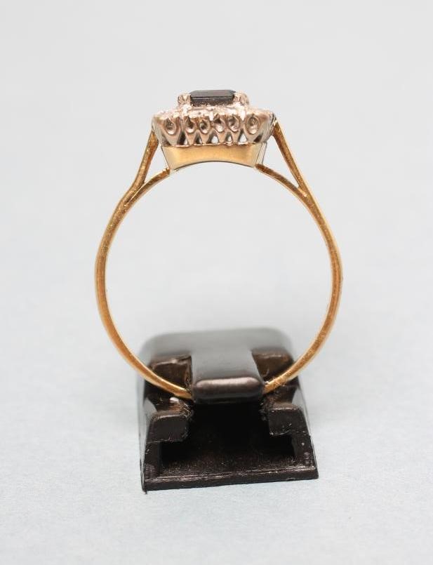 A SAPPHIRE AND DIAMOND CLUSTER RING Image