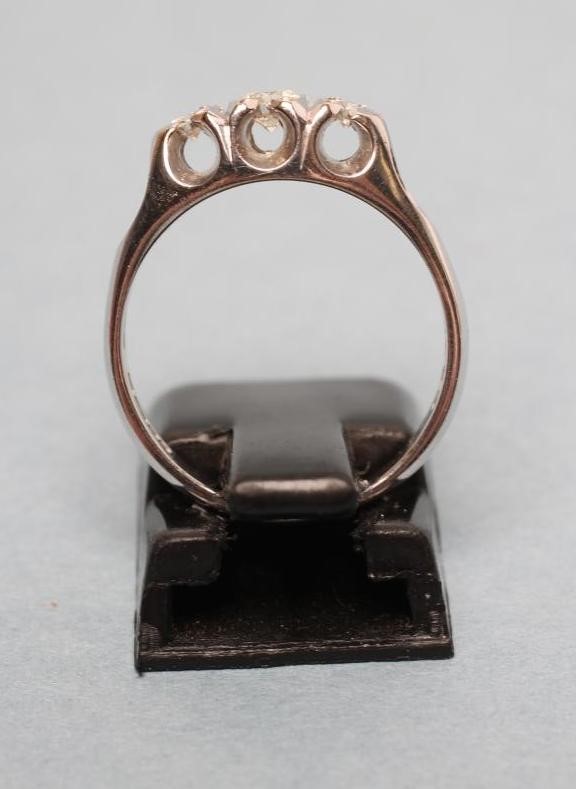 A THREE STONE DIAMOND RING Image